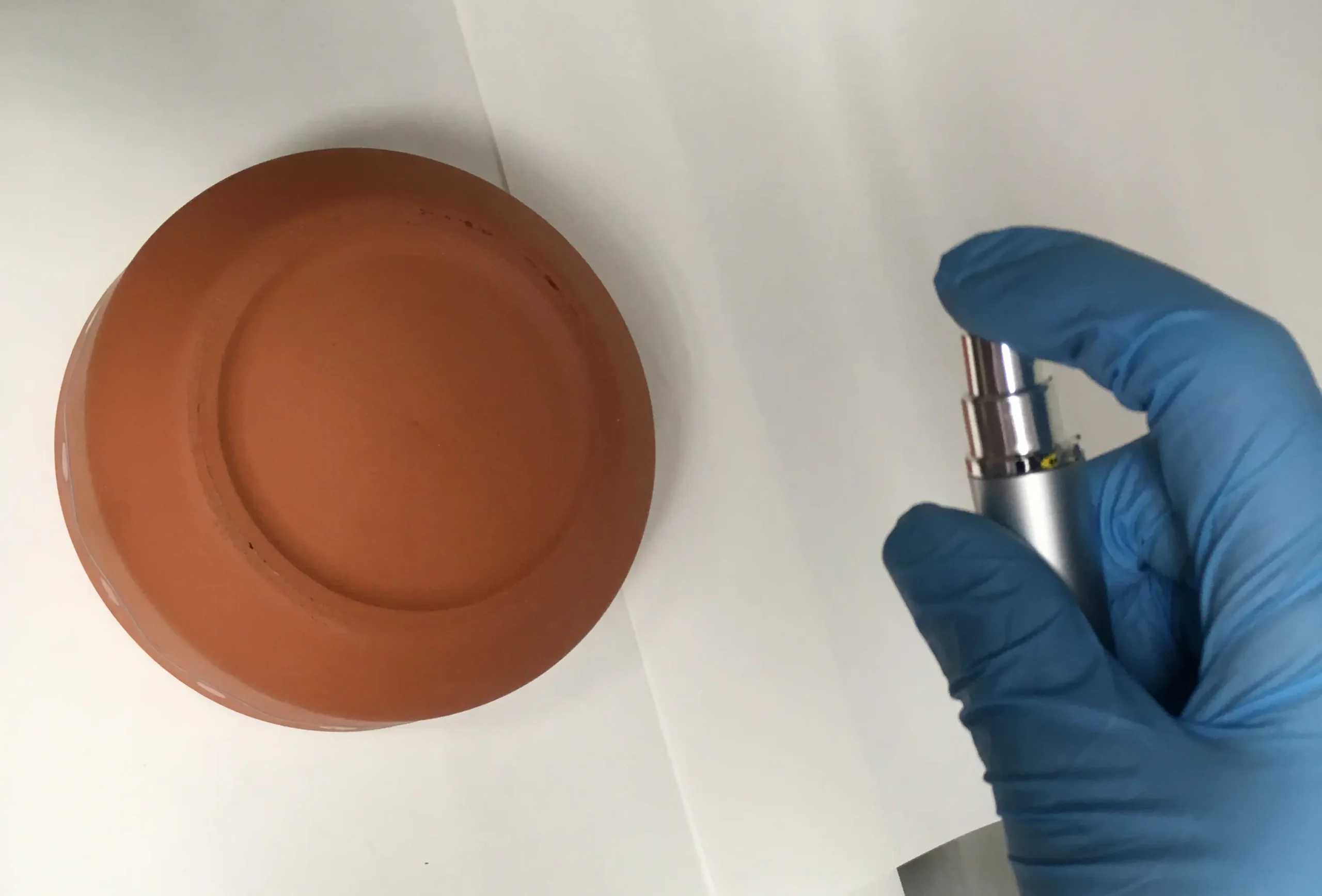 Artifact being sprayed with SmartWater forensic solution